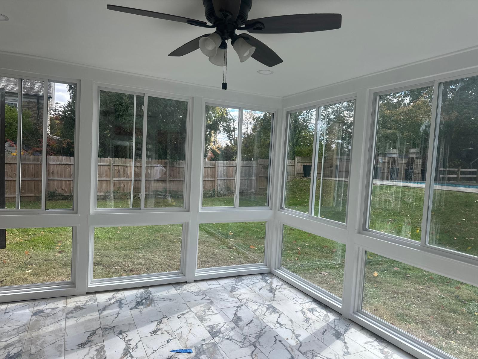 Freshly painted sunroom with marble-look tile floor, Chester County, PA